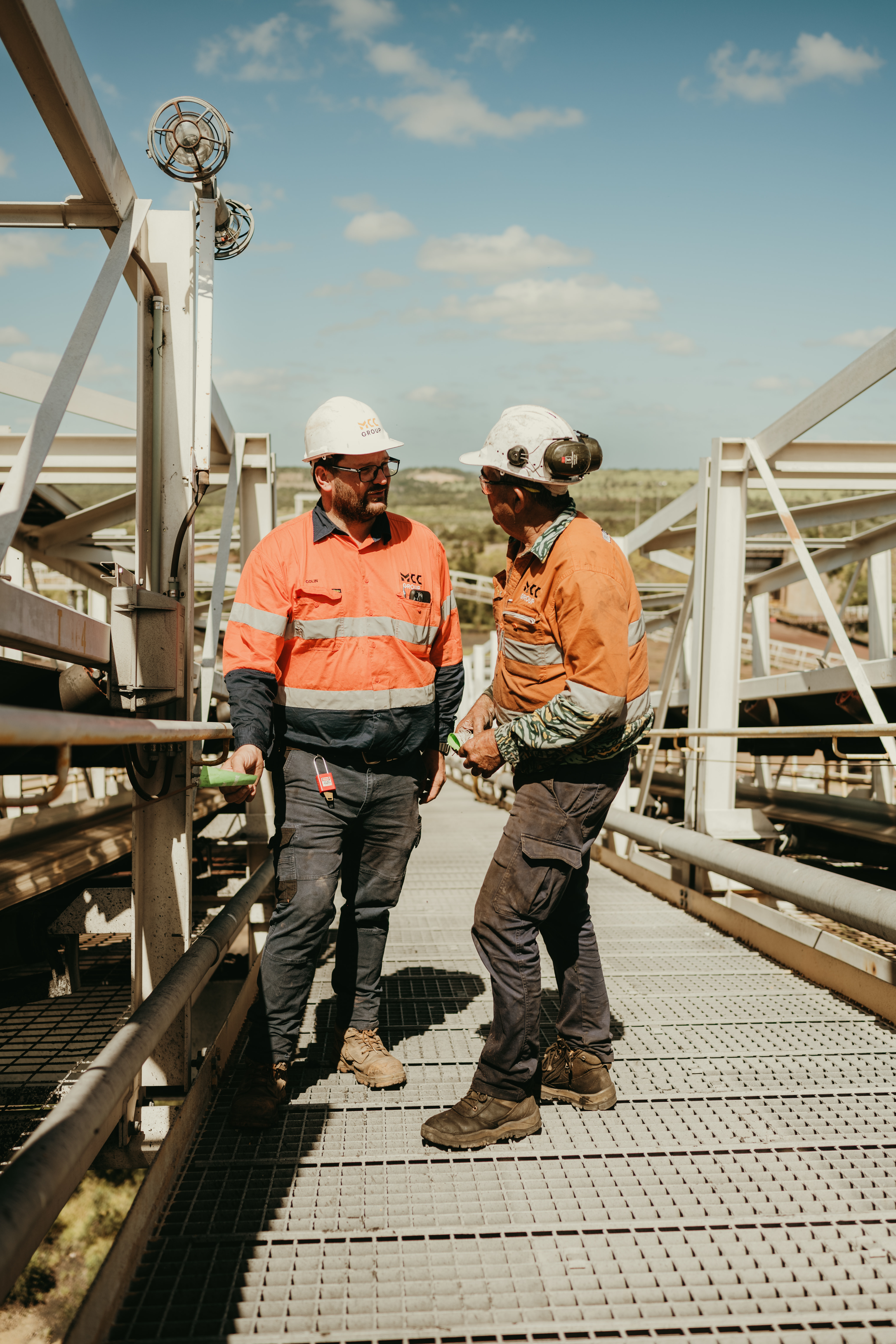 Two MCC Group team members collaborating on a mine site platform